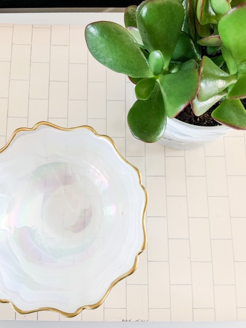 bowl and plant used on table as decor
