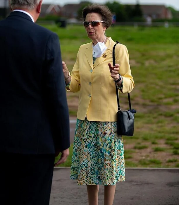 The Princess Royal wore a yellow jacket, blazer and floral print midi skirt or dress. Burgundy leather bag and sunglasses