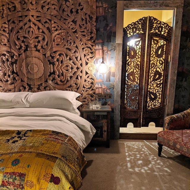 bed and carved headboard at portobello hotel