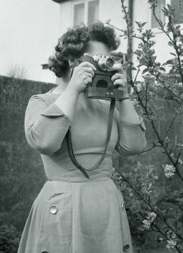 Lady with a Leica, somewhere in England, circa 1950s.