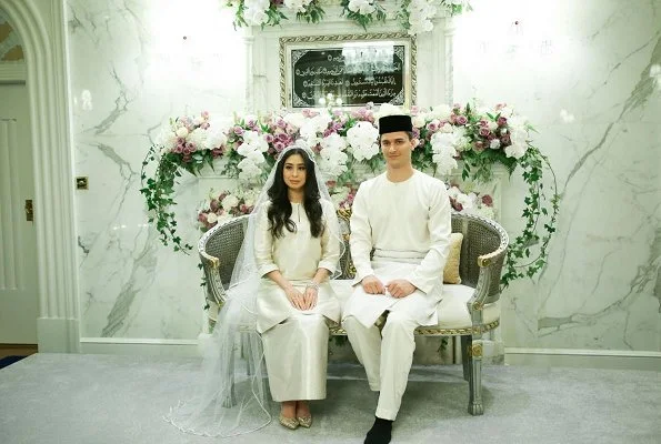 Dutchman Dennis Muhammad and Johor Princess Tunku Tun Aminah Maimunah Iskandariah Sultan Ibrahim, after wedding ceremony at the Istana Besar. wedding dress