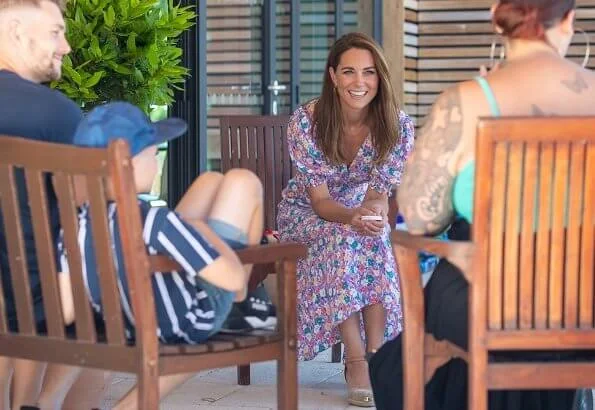 Kate Middleton wore a new pastel floral pattern dress by Faithfull the Brand, Russell and Bromley wedges, Accessorize hoop earrings