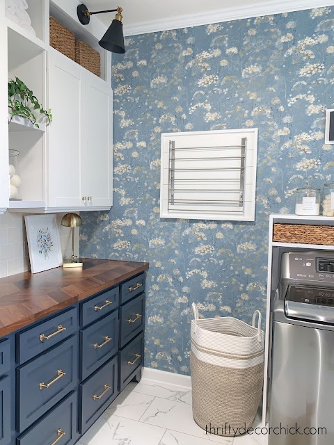 Blue floral wallpaper mud room cabinets