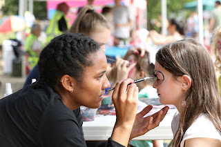 Facepainters at the Mile End Park Community Fair