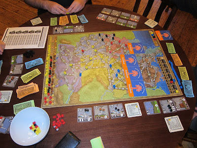Power Grid - The board with a line of Oranjeboom beer mats marking the area of the board not in play