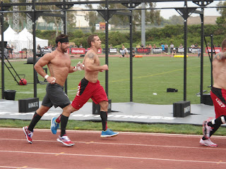 Image of CrossFit athlete Rich Froning Jr. competing in the 400 m sprint on a track during the 2012 CrossFit Games