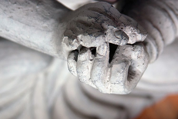 hands of a grey buddha
