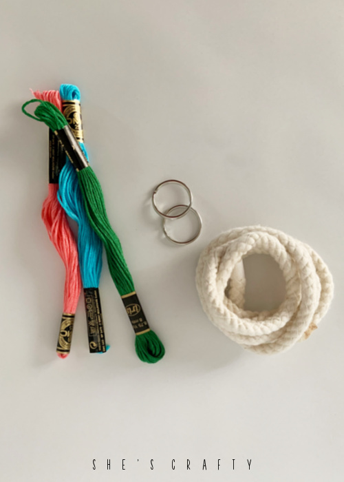 Supplies needed for making floss wrapped keychains.