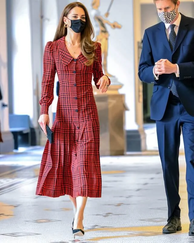 Kate Middleton wore a houndstooth silk midi dress from Alessandra Rich, and earrings from Other Stories. Jennifer Chamandi