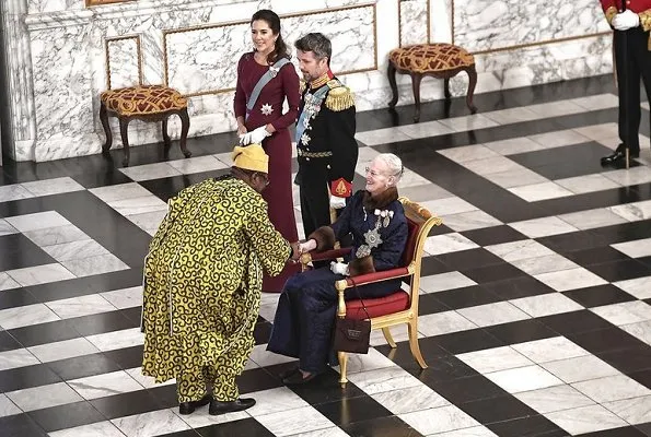 Crown Princess Mary in a fuchsia dress and cape by Danish designer Lasse Spangenberg