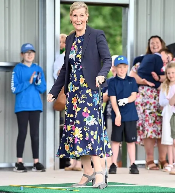 The Countess of Wessex wore a new floral stretch silk crepe midi dress from Etro. The Countess carried Sophie Habsburg clutch