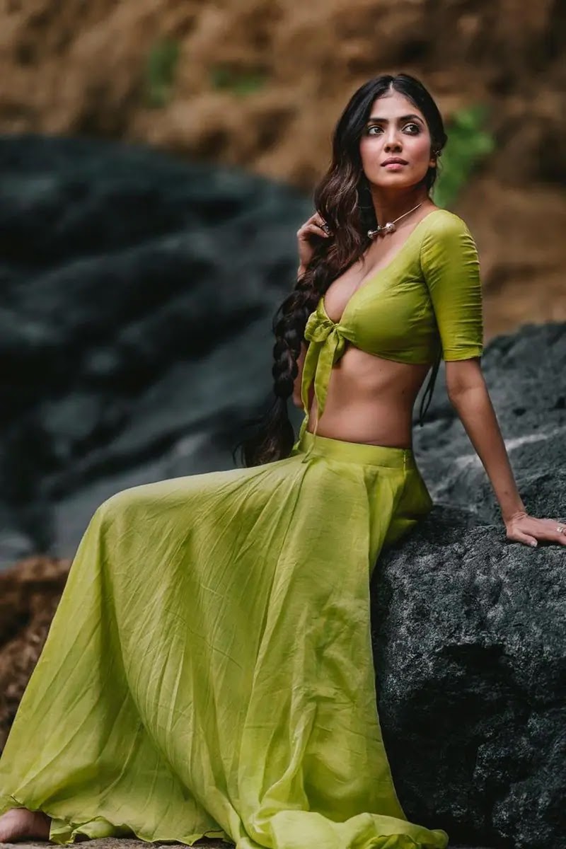 Actress Malavika Mohanan Latest Photos In Green Skirt And Knotted Blouse Actress Malavika Mohanan Latest Photos In Green Skirt And Knotted Blouse