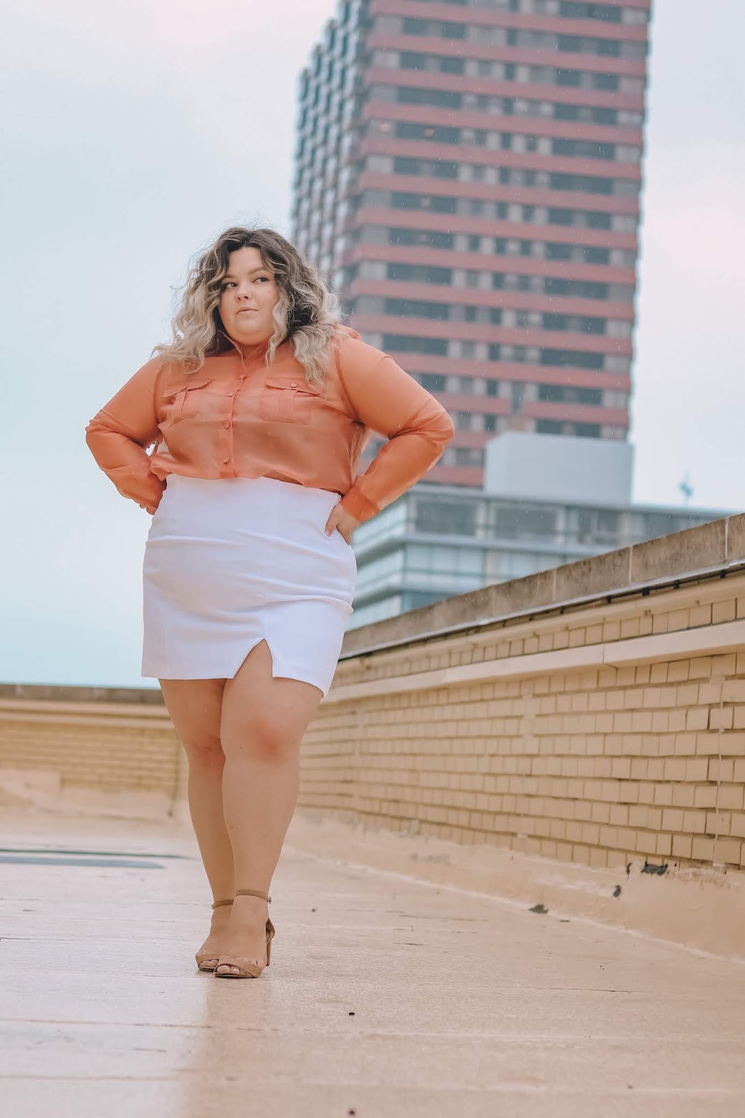 Chicago Plus Size Petite Fashion Blogger, influencer, YouTuber, and model Natalie Craig, of Natalie in the City, reviews Forever21 plus' mini skirts and organza crop tops.