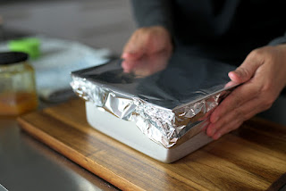 place aluminium foil on top of the baking paper