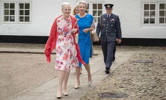 Queen Margrethe wore a floral print silk summer midi dress. Princess Benedikte wore a blue silk midi dress