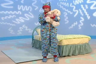 Mr. Noodle wears pyjamas go to sleep with his teddy bear. Sesame Street Elmo's World Sleep The Noodle Family