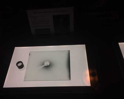 Resident Astronomer sees original glass plate of Jupiter and moons