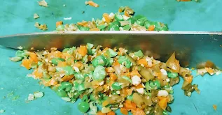 Chopping vegetables with knife for Hara bhara kabab Recipe