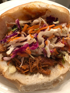 pulled pork and cole slaw on a bun