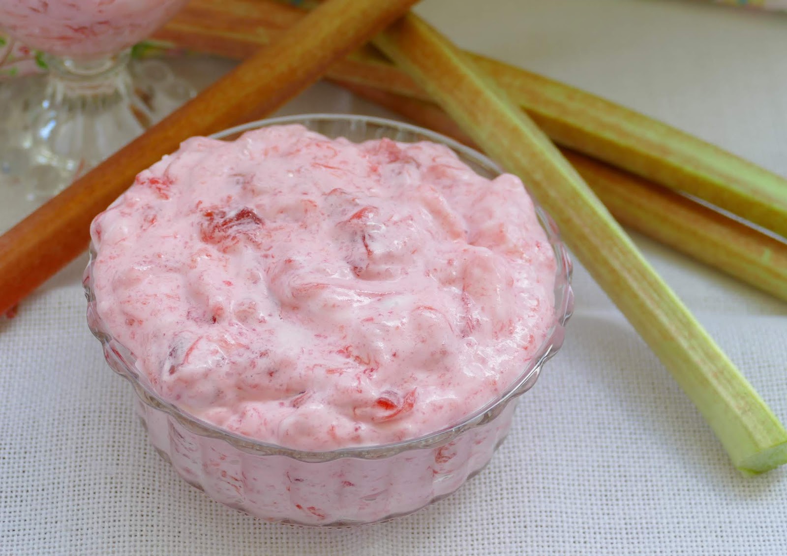 Looking for an easy and tasty spring or summer dessert? This wonderful Rhubarb Fluff Dessert Salad uses fresh or frozen rhubarb, any flavor red jello and a few other simple ingredients! It's such a crowd pleaser and perfect for any occasion!