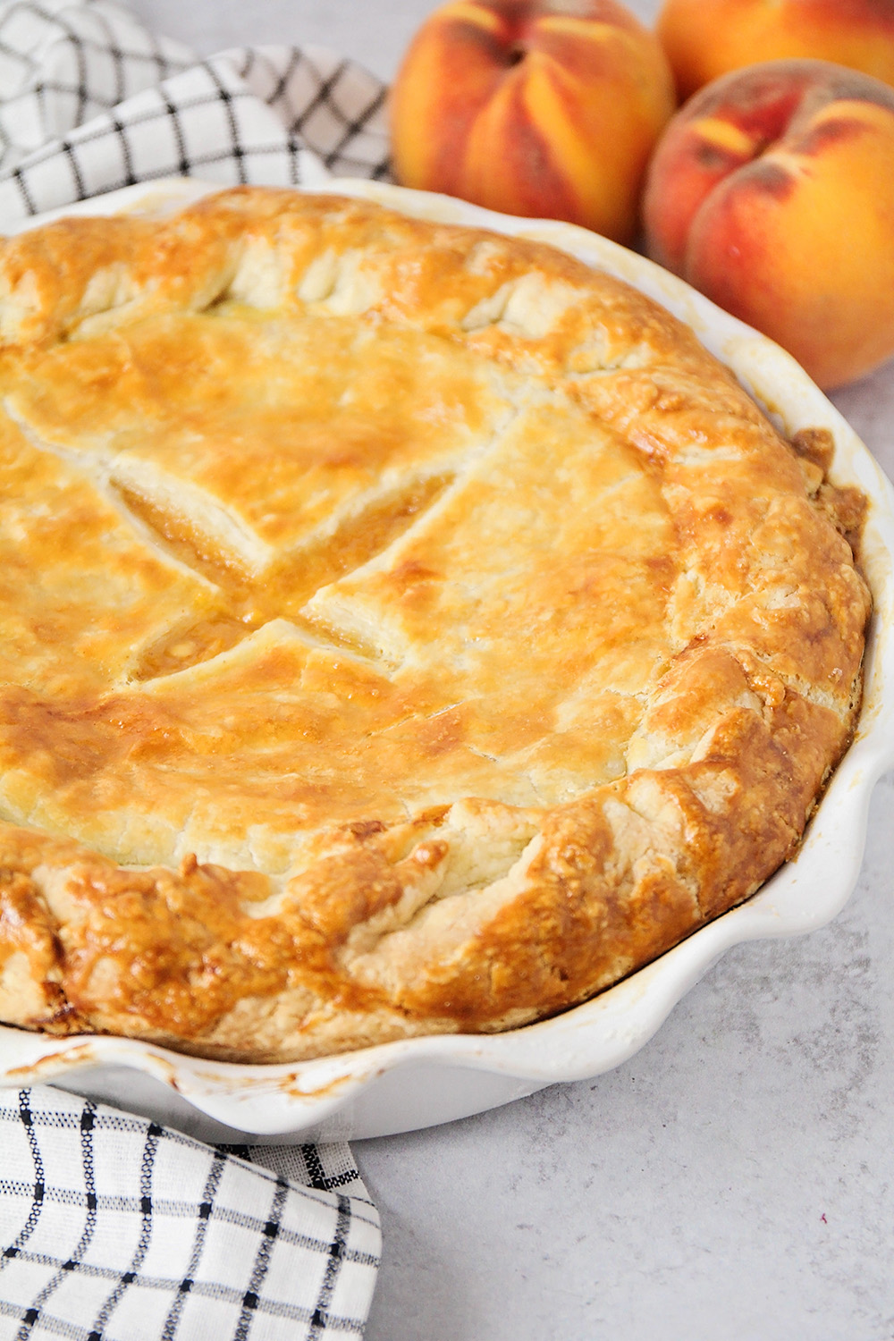 This double crust peach pie is everything you could want in a pie! It's perfectly sweetened, with juicy fruit and a rich and buttery crust.