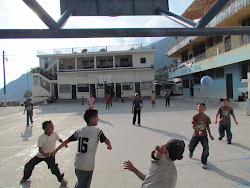 Schoolyard urchins playing soccer with plastic ball, Santa Cruz, Lago Atitlan