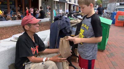 12 year old Liam Hannon prepares and distributes thousands of papers bags filled with food to the homeless people in Cambridge.