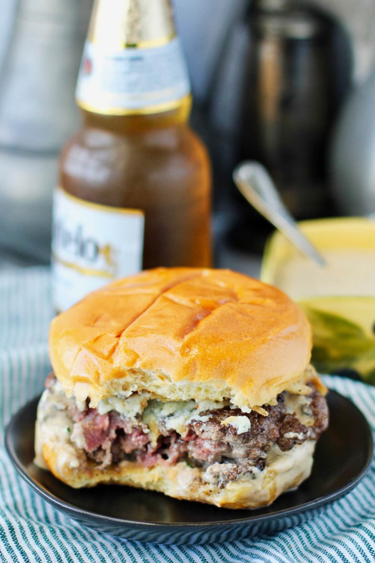 Pub-Style Short Rib Burgers with Gorgonzola, Crispy Fried Shallots, and Secret Sauce with a bite