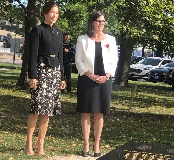 Crown Princess Mary wore a black and white floral dress from Ralph Lauren, and a structured mock-neck blazer from Max Mara. Naledi Gianvito Rossi