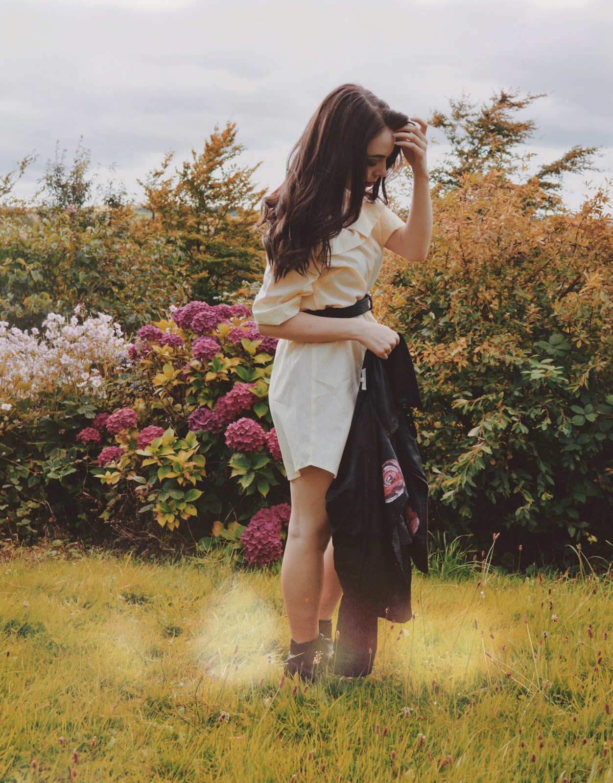 girl in field with wildflowers