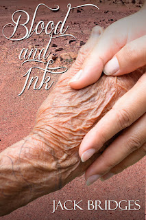 Image of a young person's hand holding an older person's tattooed hand