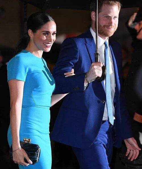 Meghan Markle wore Victoria Beckham pencil midi dress. Meghan, Duchess of Sussex and Prince Harry, Duke of Sussex