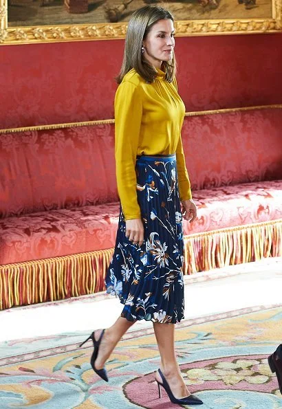 Queen Letizia wore HUGO BOSS Viplisa printed Skirt Magrit shoes and Hugo Boss yellow blouse