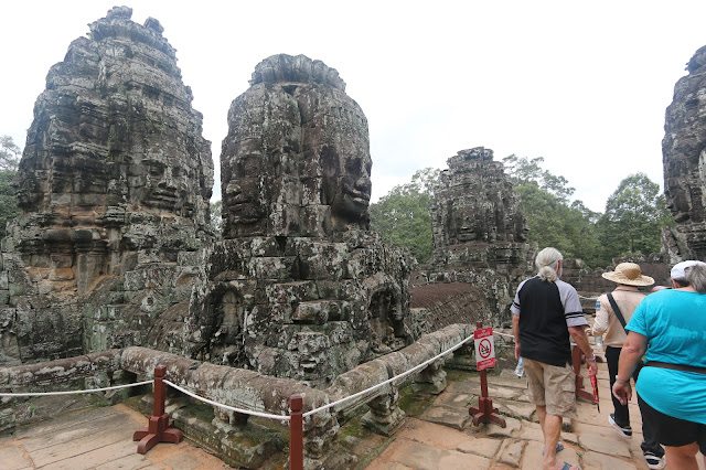 A closer look at the stone faces on the towers at Bayon Temple in Siem Reap, Cambodia A closer look at the stone faces on the towers at Bayon Temple in Siem Reap, Cambodia