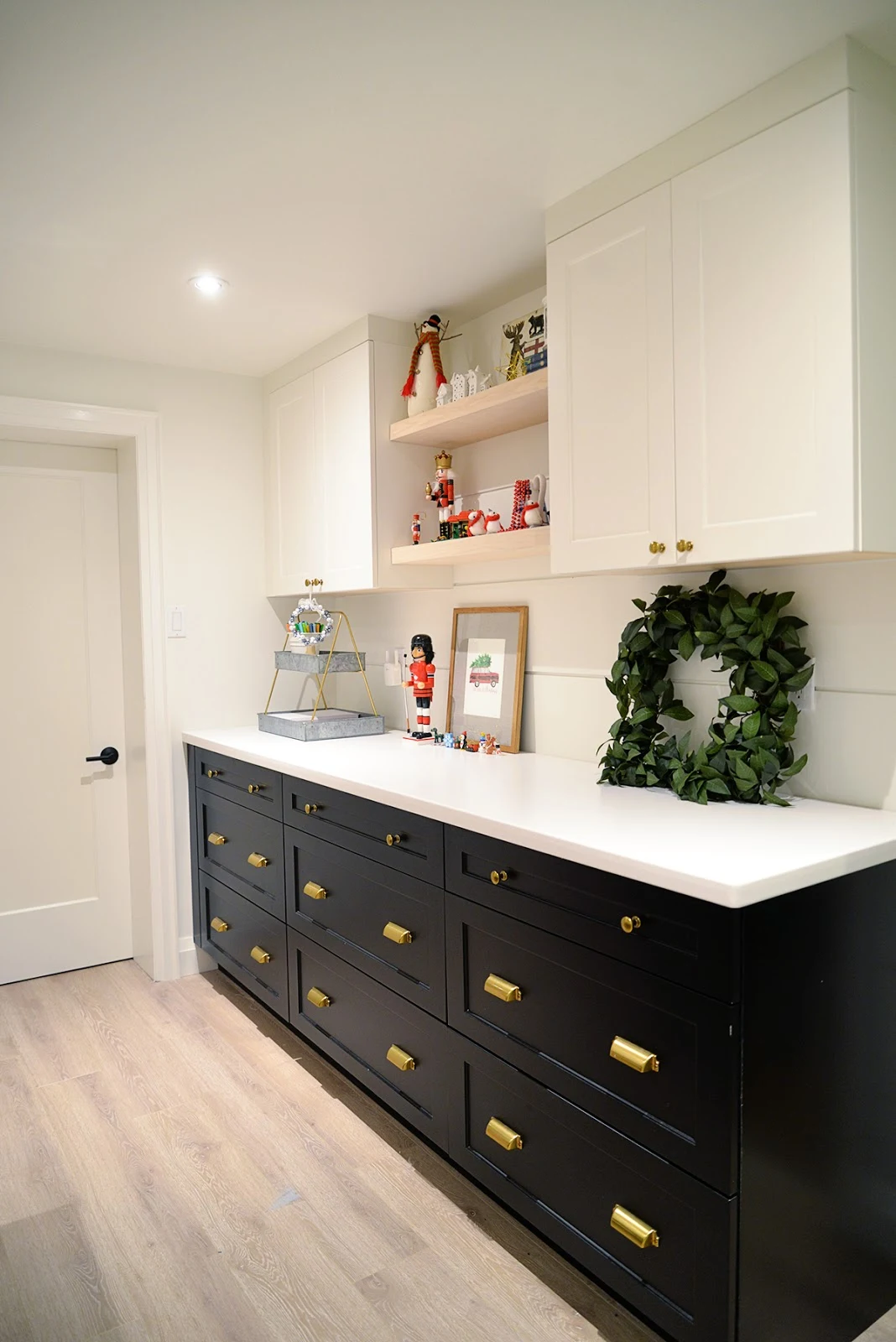 black and white cabinetry, a craft room decorated for Christmas
