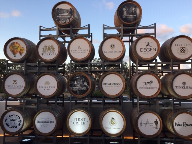 wine barrels on racks at Brokenwood winery