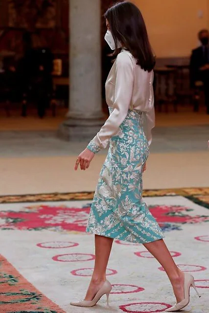 Queen Letizia wore a bespoke a mint blue embroidered pencil skirt and an ecru satin blouse from Juan Duyos. Magrit Cara clutch and Magrit pumps