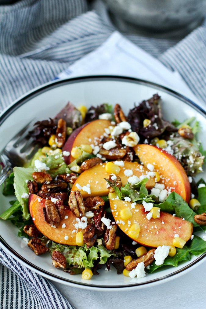 Summer salad of Mixed Greens, Peach, and Corn with Balsamic Maple Vinaigrette