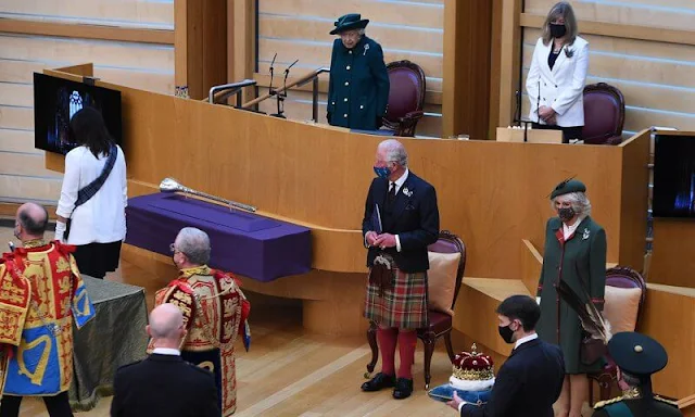 The Queen selected Queen Mary's Diamond Thistle Brooch for her lapel. Prince of Wales and Duchess of Cornwall