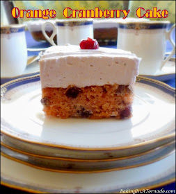 Orange Cranberry Cake features favorite seasonal flavors. This cranberry studded orange cake is frosted with cranberry whipped cream. |  Recipe developed by www.BakingInATornado.com | #recipe #cake