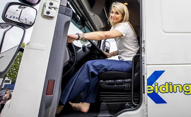 Queen Maxima wore a white silk top from Natan, and denim trousers from Natan. Transport and Logistics sector