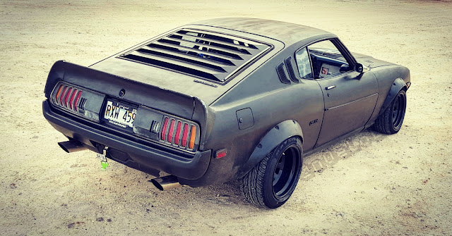 1977 black custome Toyota Celica in Sand