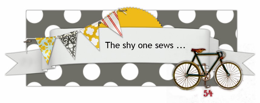 The shy one sews ...