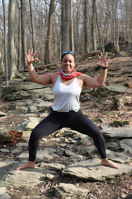 Black woman yoga outdoors goddess pose