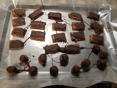 a tray of vegan caramels with chocolate drizzle