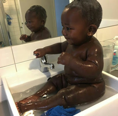  Young African mom celebrates her cute son with the most beautiful black skin