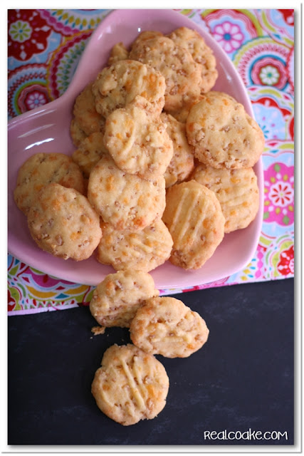 Cheese Rice Krispie Wafers spilling off plate
