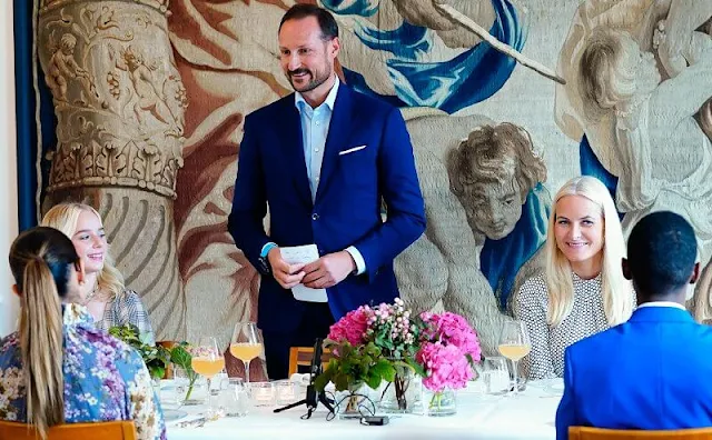 Crown Princess Mette-Marit wore a high neck belted polka-dot silk midi dress by Diane von Furstenberg. Malone Souliers Brenda stripe pumps