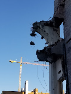 demolished building against a blue sky