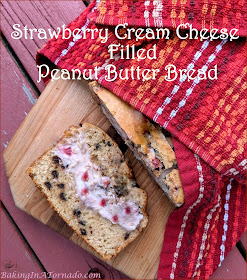 Strawberry Cream Cheese Filled Peanut Butter Bread gets its inspiration from peanut butter and jelly sandwiches. Mini chocolate chips add a little sweetness to the bread and Strawberry cream cheese filling is a fun surprise inside. | Recipe developed by www.BakingInATornado.com | #recipe #bake